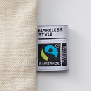 フェアトレードコットン商品には認証ラベルが付きます（参考写真）